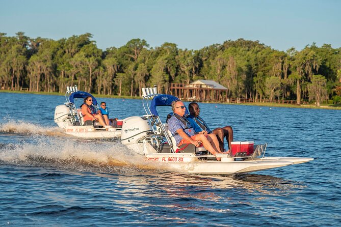 Tour of Lakes Escape by Personal Catamaran - Steering through cypress trees and wetlands